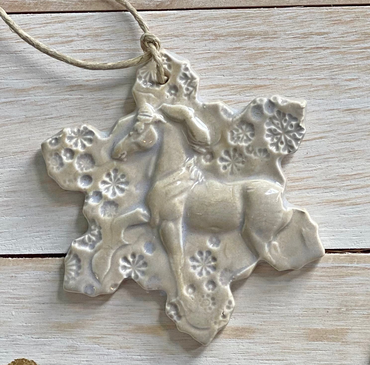 white horse ceramic ornament with snowflakes